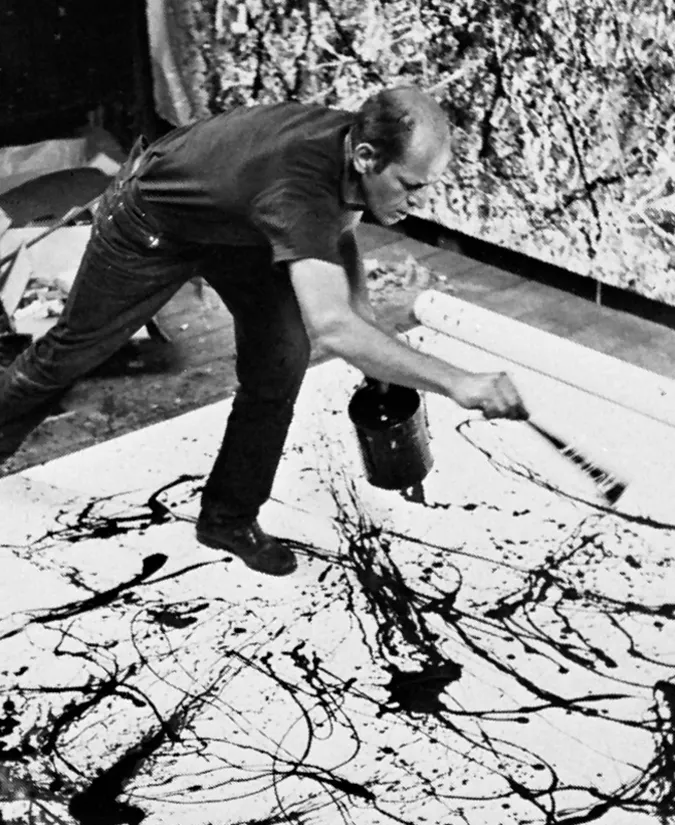 Jackson Pollock painting in his studio